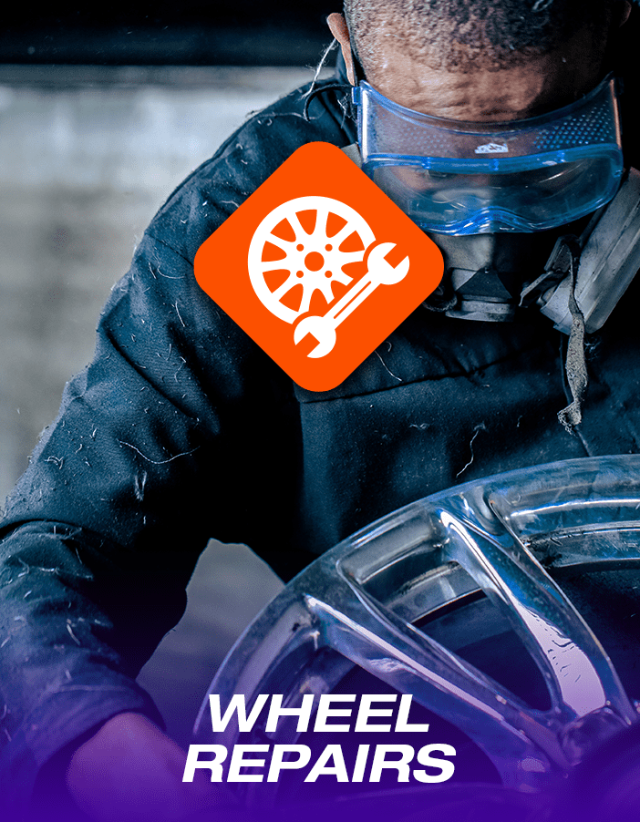 Wheel repair promotion banner: A wheel-technician performing expert alloy wheel repair.