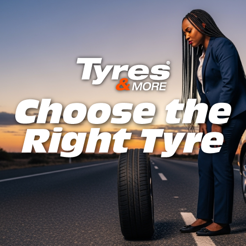 A lady standing in the road with a tyre pondering on how to choose tyres for her vehicle in the future