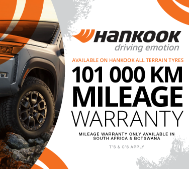 hankook mileage warranty: an SUV driving over rocky terrain