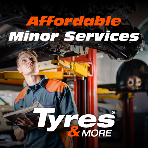 Minor Services A tyres & more technician looking beneath a lifted vehicle