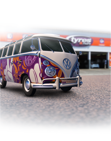 Tyres & More about us illustration; a VW van painted the colours of Tyres & More parked in front of a Tyres & More store.
