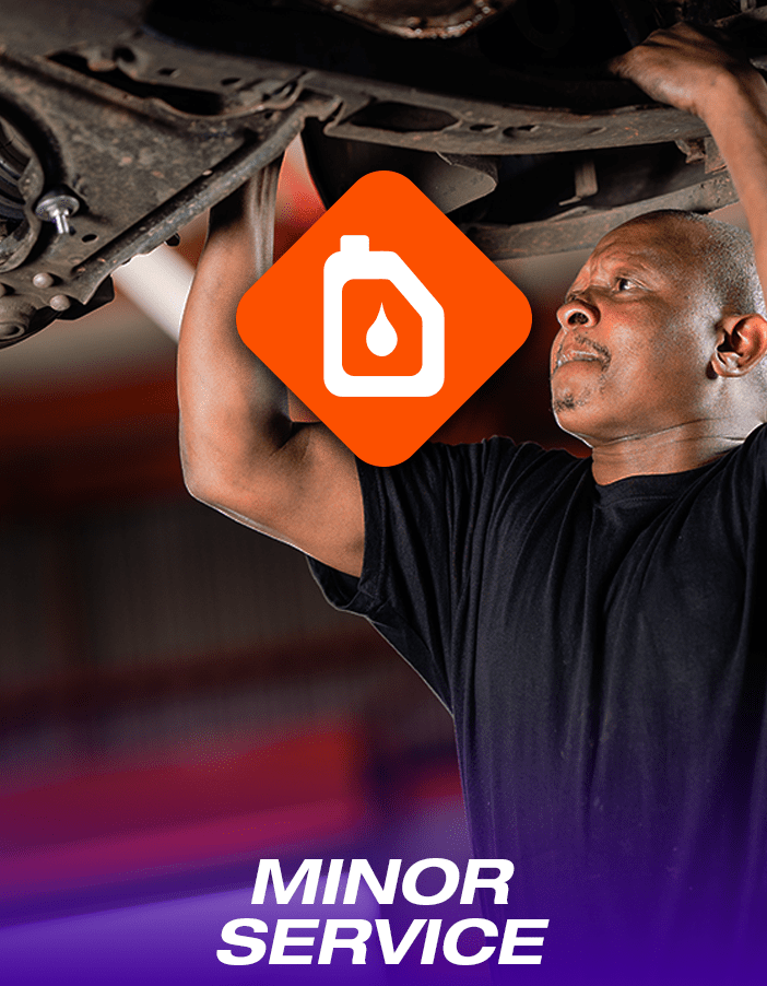 A Tyres & More technician performing a minor car service