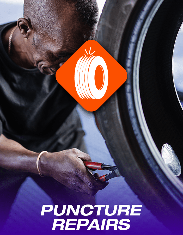 A Tyres & More technician performing a tyre puncture repair