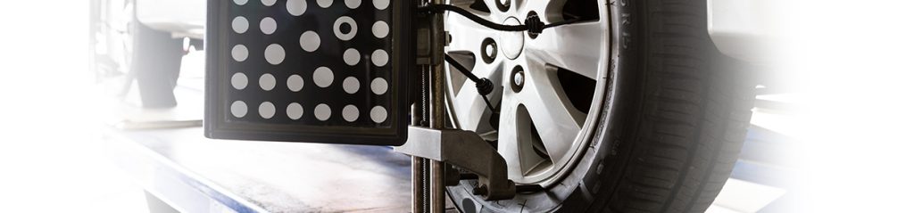 A wheel alignment device attached to a car's wheel