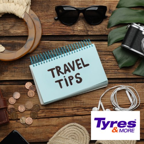 Travel Tips A notebook of travel tips sitting on a desk with other travel items